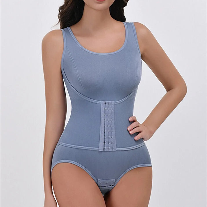 Woman wearing a blue compression bodysuit on a white background