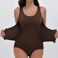 Brown bodysuit worn by a model on a white background