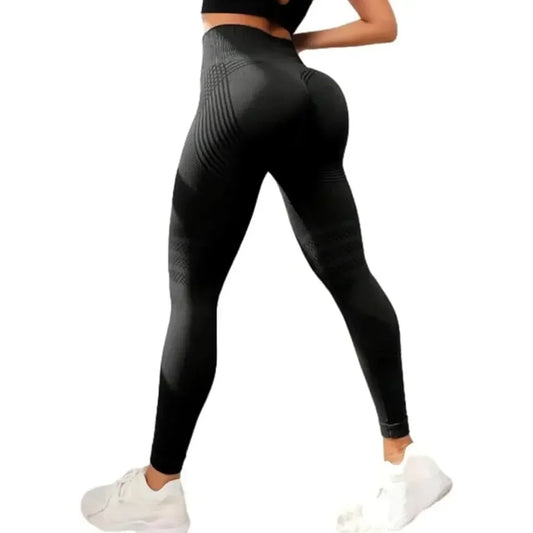 Black leggings worn by a person on a white background