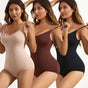 Three women wearing seamless bodysuits in beige, brown, and black with adjustable straps